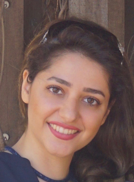 Maryam Parsa wears a navy, sleeveless top in front of a neutral background in her faculty profile for the Department of Electrical and Computer Engineering