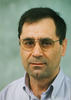 Mason ECE professor Yariv Ephraim wears a light-blue shirt and glasses in his faculty profile
